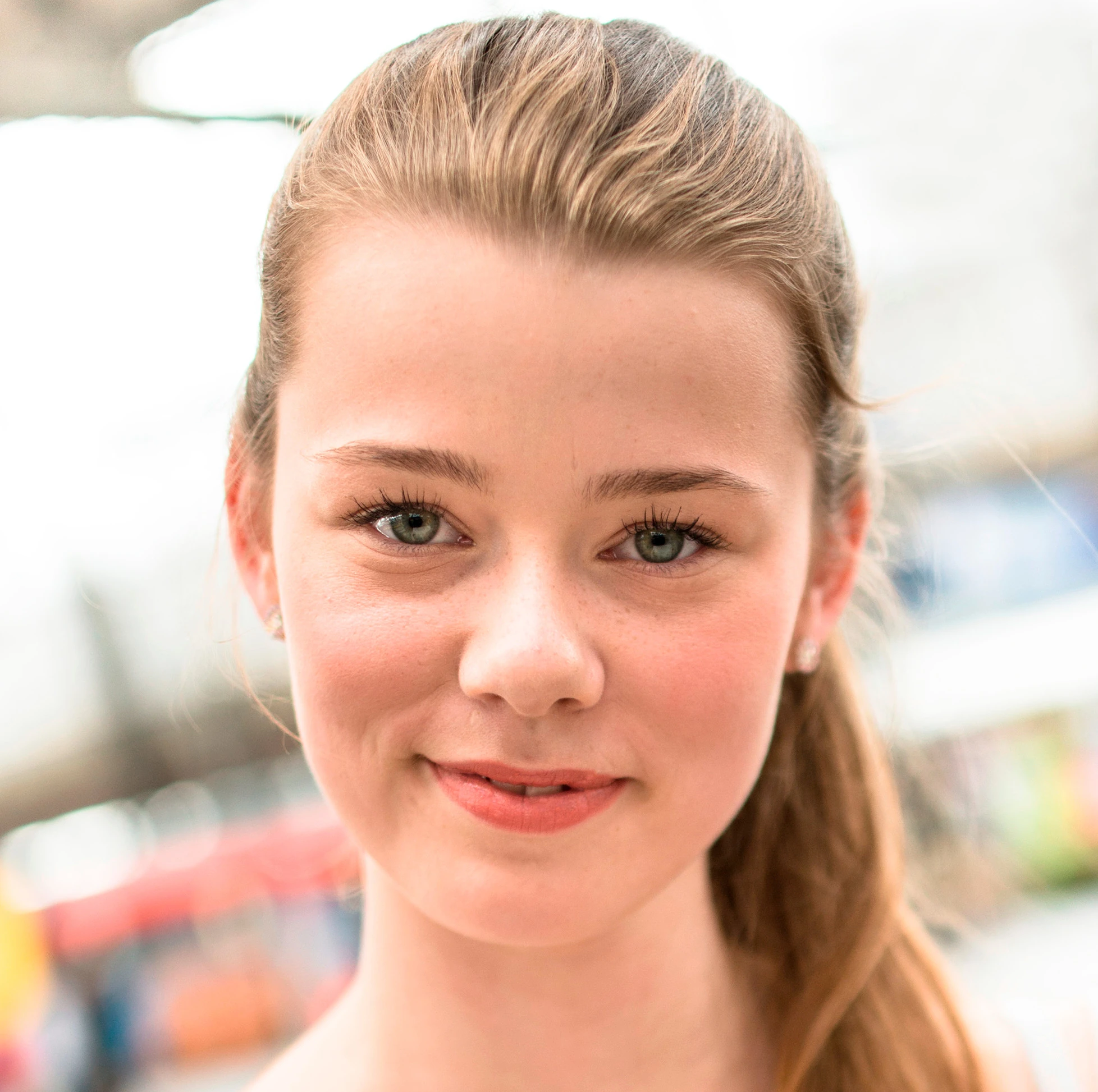 High-resolution portrait a beautiful blond girl with enhanced facial details and skin texture at high resolution